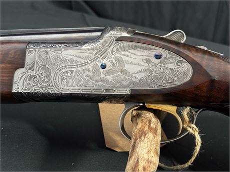A FINE BROWNING PRIVILEGE 12 BORE OVER AND UNDER SHOTGUN