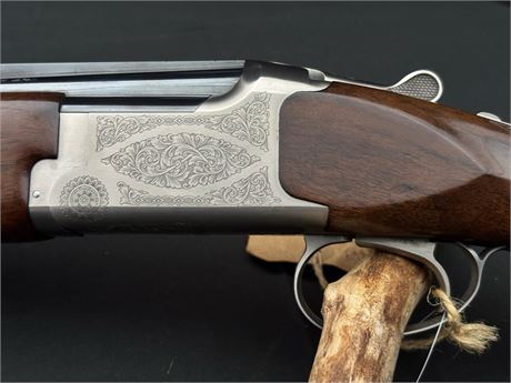 A MIROKU M560 20 BORE OVER AND UNDER SHOTGUN