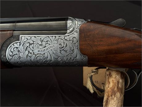 A FINE RIZZINI ROUND BODY EM 12 BORE OVER AND UNDER SHOTGUN