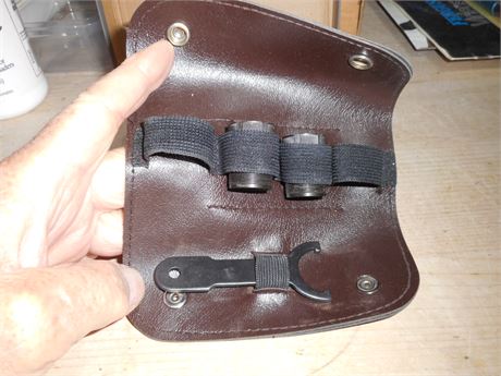 A PAIR OF 12 BORE CHOKES AND REMOVAL TOOL IN POUCH