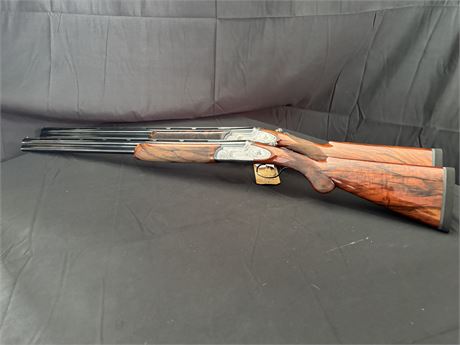 A FINE PAIR OF RIZZINI EMEL 20 BORE OVER AND UNDER SHOTGUNS