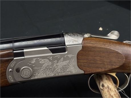 A BERETTA 'ULTRALIGHT' 12 BORE OVER AND UNDER SHOTGUN