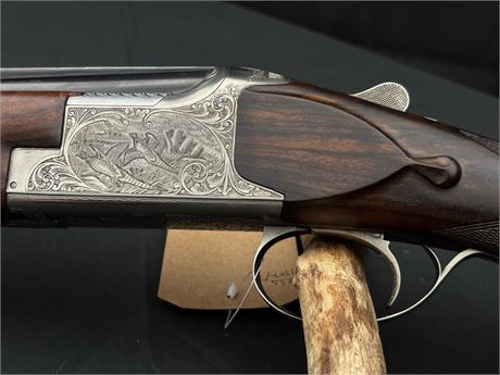 A STUNNING BROWNING 20 BORE OVER AND UNDER SHOTGUN