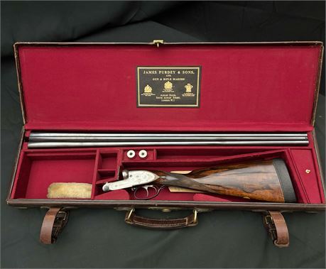 A JAMES PURDEY & SONS SIDE LEVER DOUBLE BARRELLED 12 BORE SHOTGUN