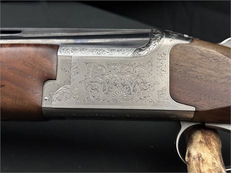 A FINE MIROKU 3800 12 BORE OVER AND UNDER SHOTGUN