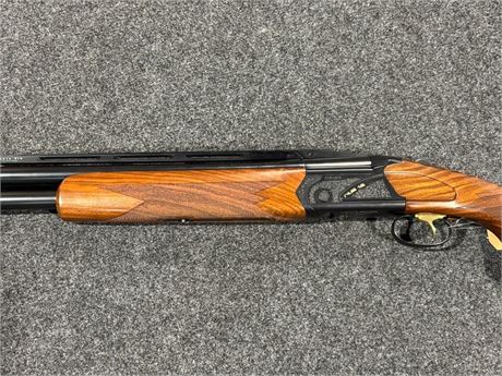 A FABARM RS 12 QPR 12 BORE OVER AND UNDER SHOTGUN